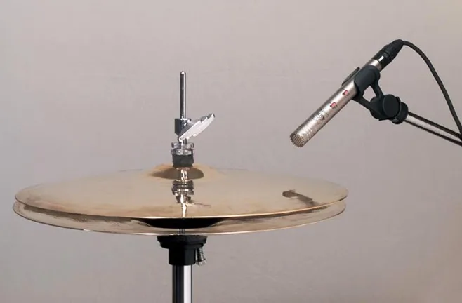 Shure SM81 cardioid condenser, used overhead or as a hi-hat and ride spot mic